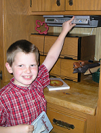 Saint Anne's Helper Catechism Boy At CD Player