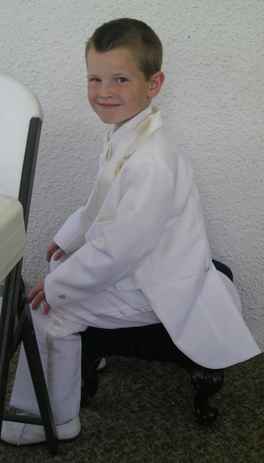 First Communion Suits: Tux with bow tie and white shoes.